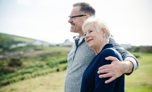 adults-arms-around-couple-1586481